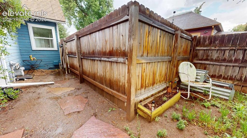 Image 37 of 49: Side yard and garden