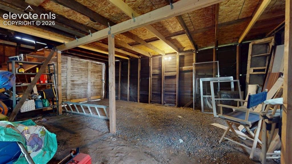 Image 47 of 49: View from person door into garage