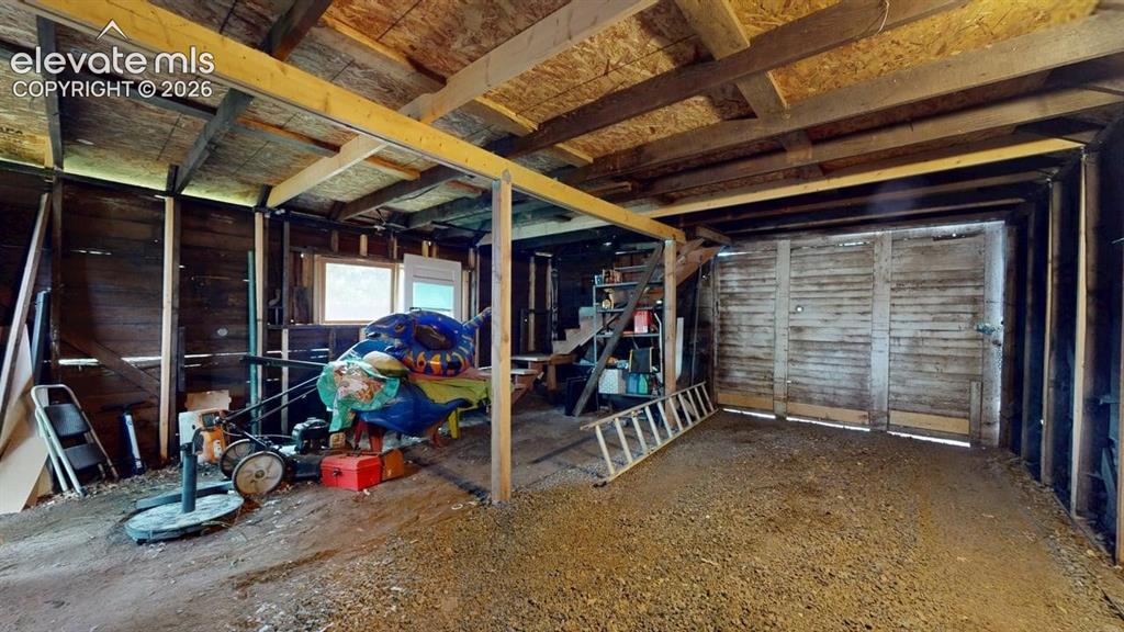 Image 48 of 49: 1 car side with view of work/storage space