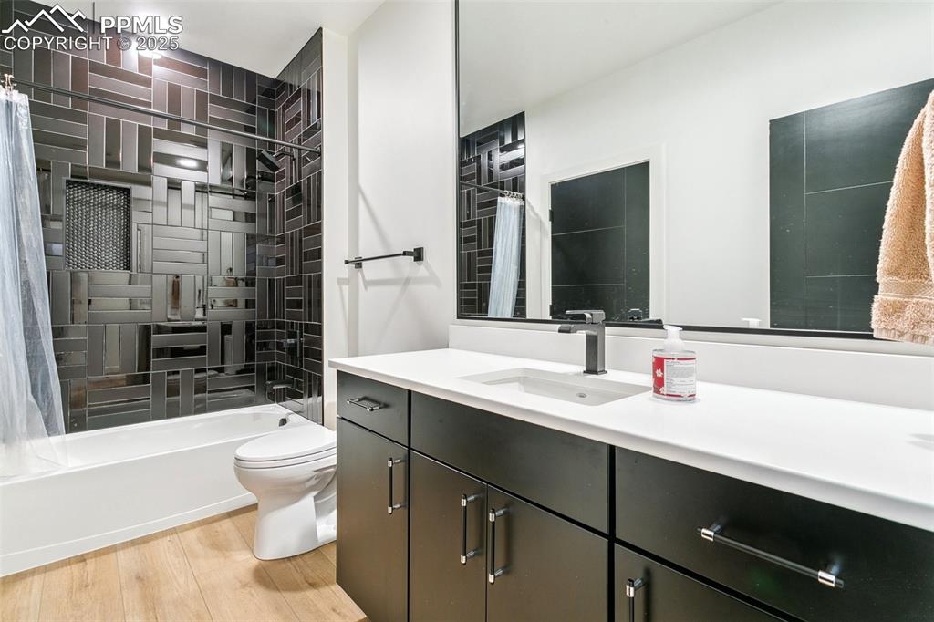 Image 41 of 50: 5th bedroom en suite bathroom with public access for lower level