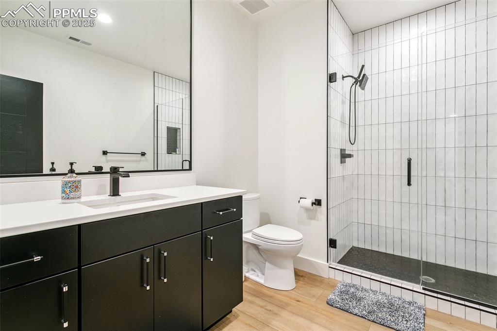 Image 44 of 50: En suite for one of the lower level bedrooms