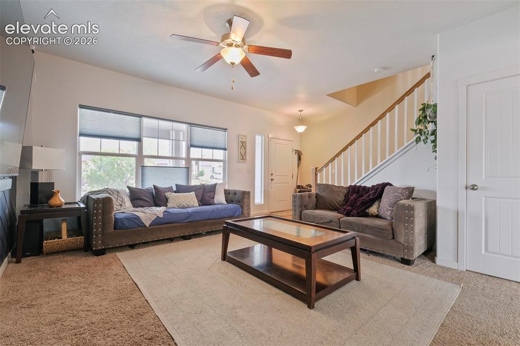 Image 5 of 33: Main Level: Open-concept living area featuring a prominent window wall with
