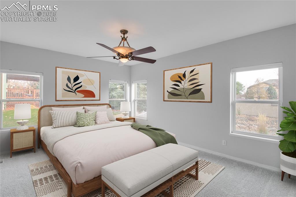 Image 4 of 45: Virtually Staged Main Floor Primary Bedroom