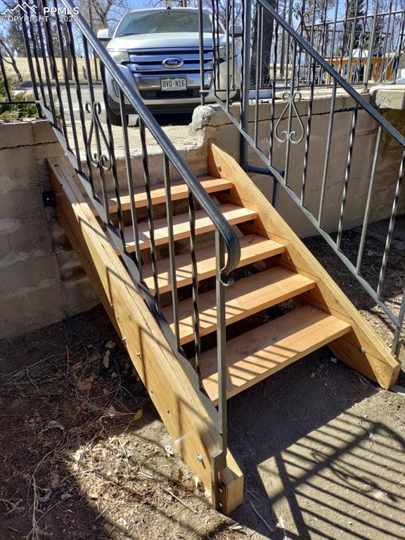 Image 14 of 22: Wooden terrace featuring stairs