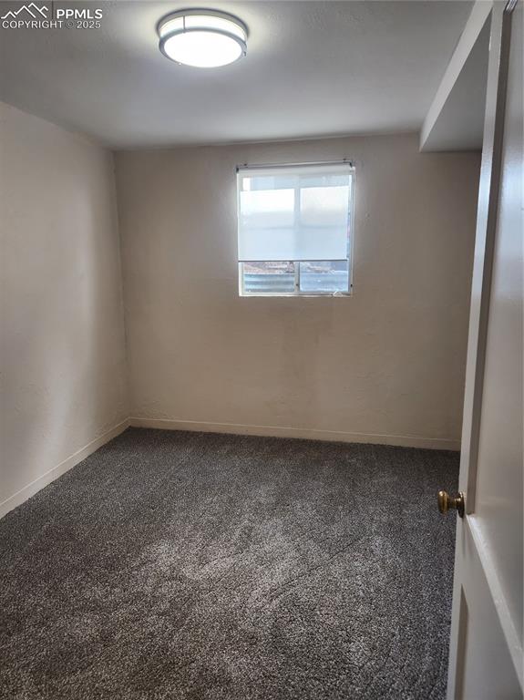 Image 15 of 22: Carpeted empty room featuring baseboards