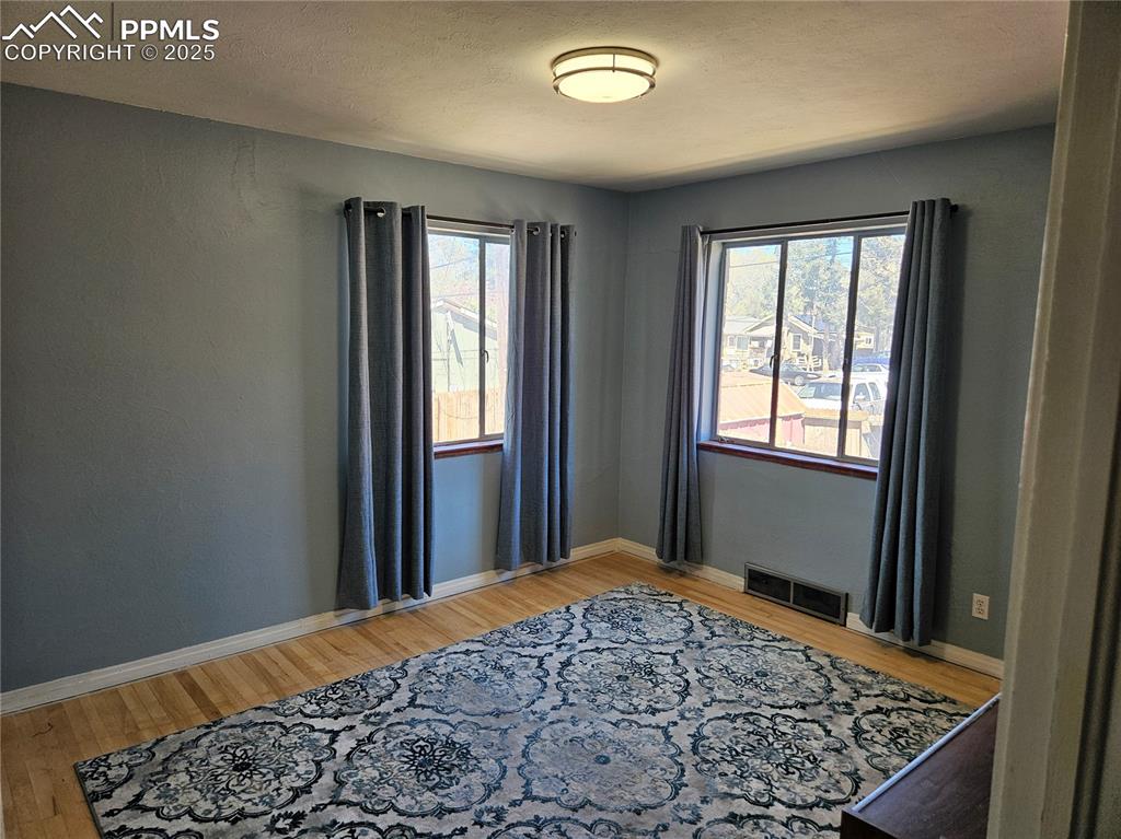 Image 6 of 22: Bedroom featuring light wood-style flooring and baseboards