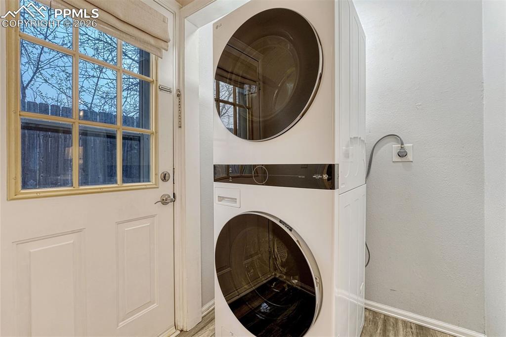 Image 14 of 30: Convenient laundry area with added storage