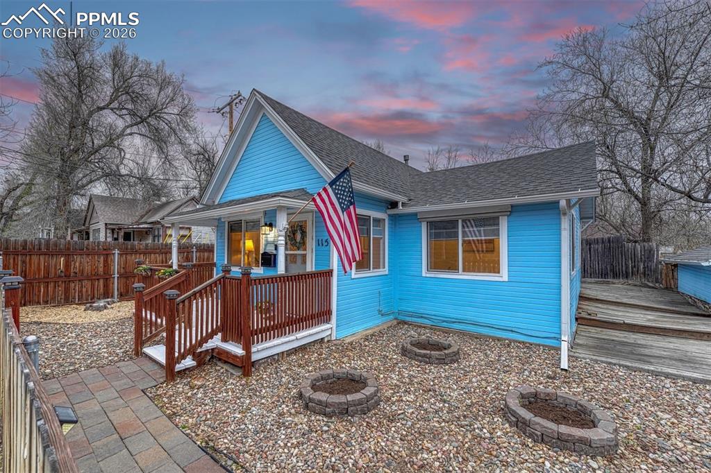 Image 2 of 30: Charming front porch perfect for morning coffee