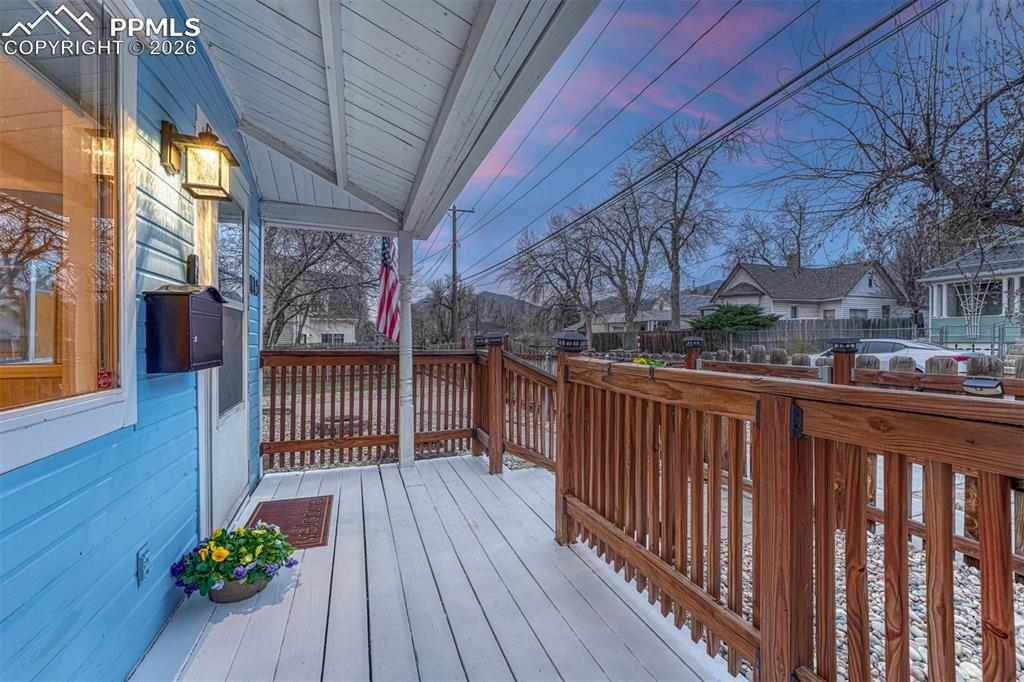 Image 24 of 30: Charming front porch perfect for morning coffee