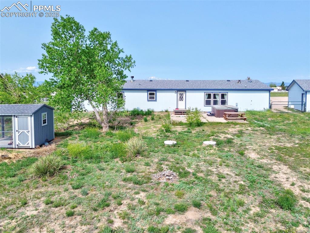 Image 4 of 48: View of back of house