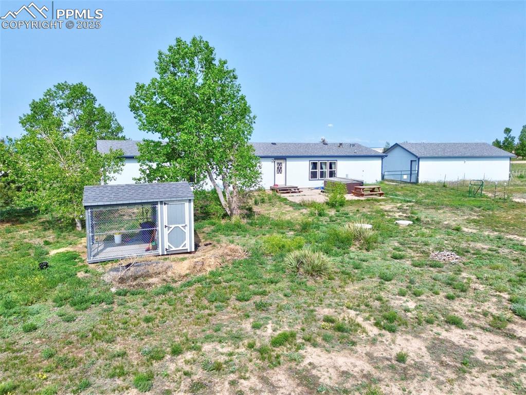 Image 41 of 48: View of yard with an outdoor structure