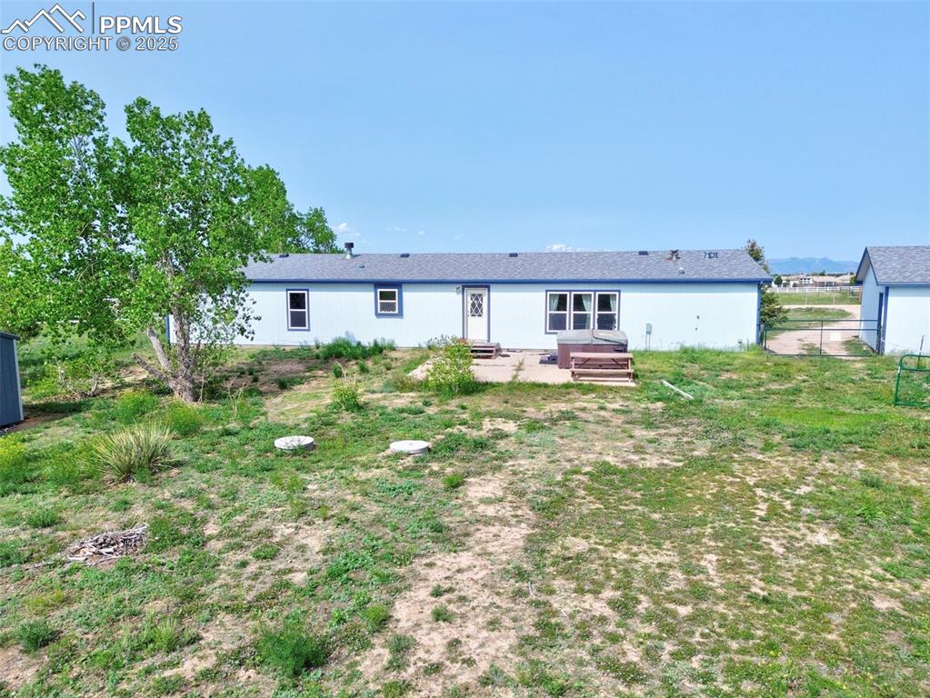 Image 42 of 48: Rear view of property featuring entry steps