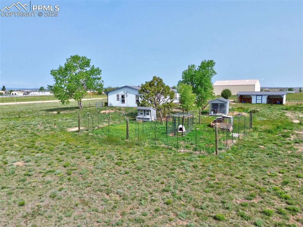 Image 6 of 48: View of yard featuring an outdoor structure, exterior structure, and an out