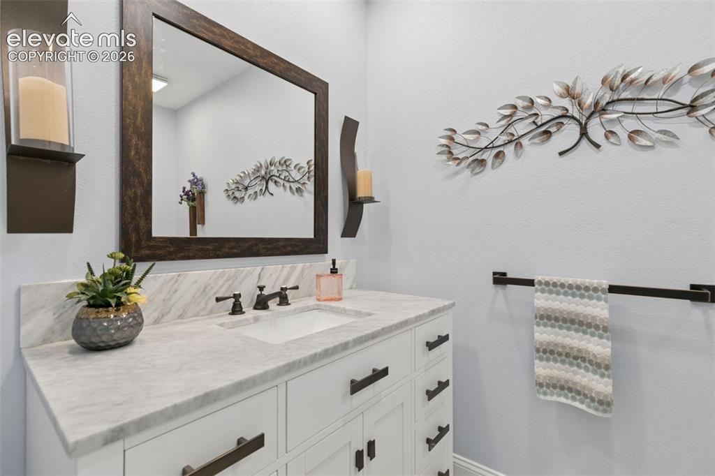 Image 11 of 48: Updated half bath