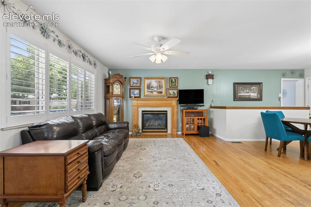 Image 13 of 48: Main living room with natural hardwood floors