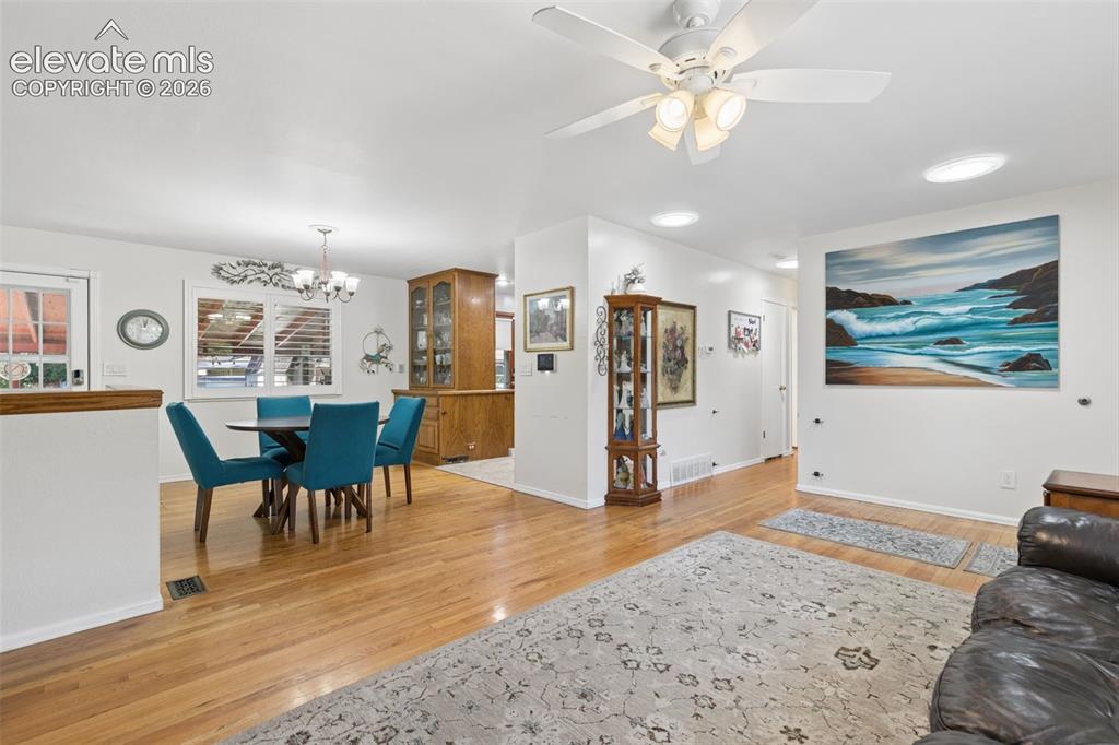 Image 15 of 48: Main living room with natural hardwood floors