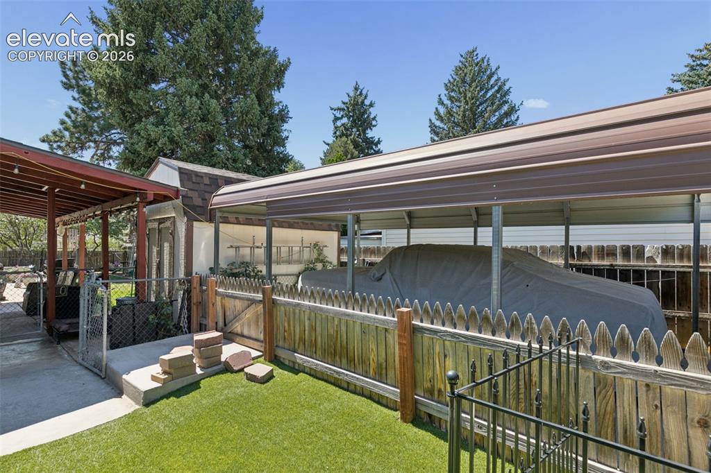 Image 38 of 48: awesome gated carport parking