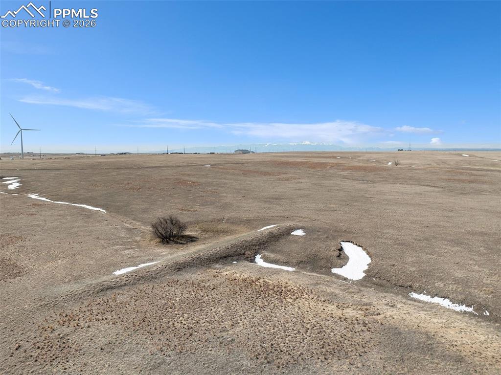 Image 7 of 17: View showing open plains and surrounding rural acreage.