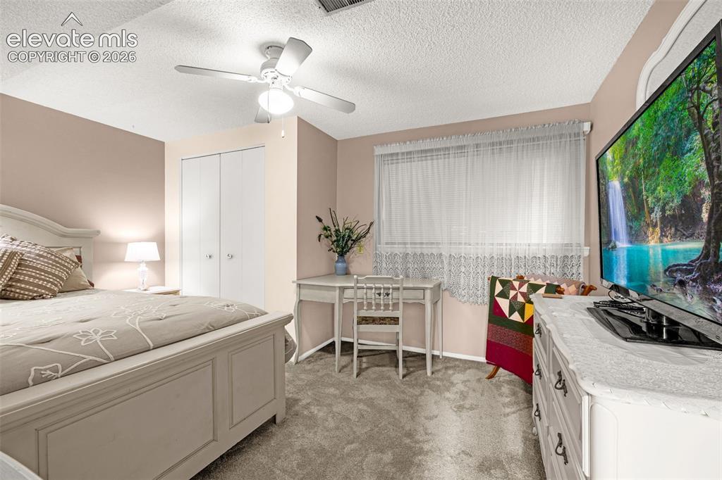 Image 13 of 32: Second bedroom is spacious, new carpet, large closet and ample room for des
