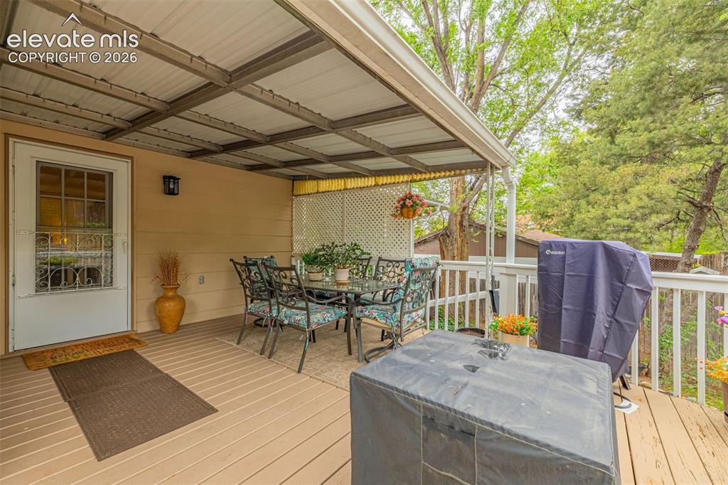 Image 19 of 32: Another look at the private, covered deck with metal beams and ample room f