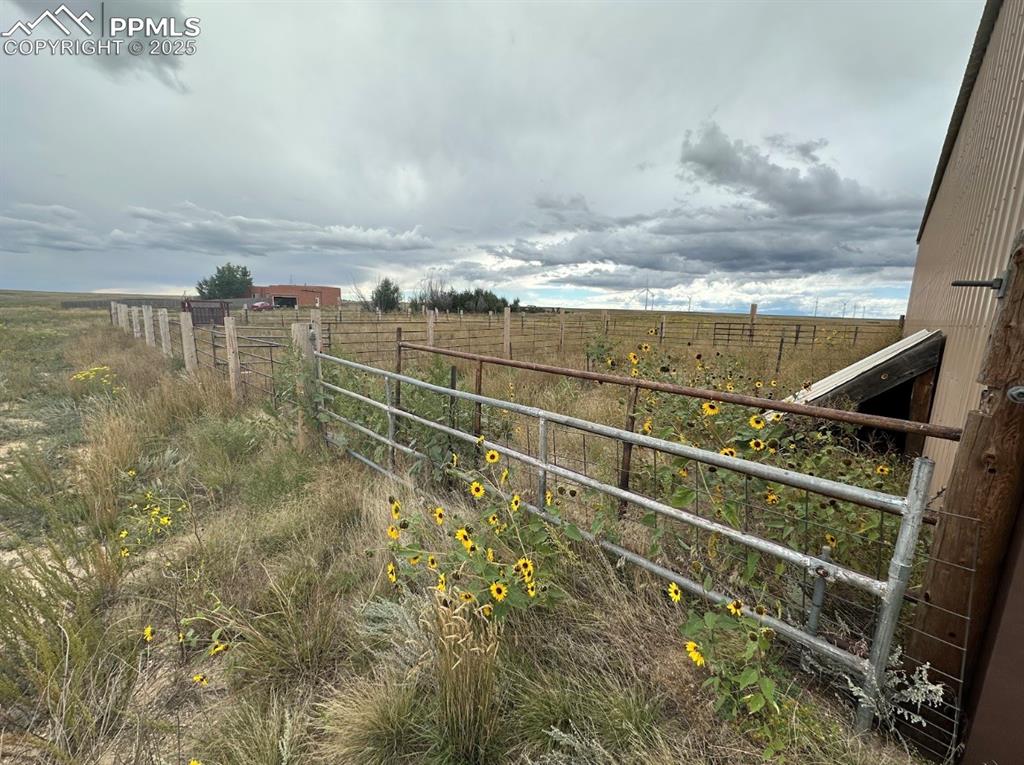 Image 10 of 36: View of yard with a view of rural / pastoral area and a balcony