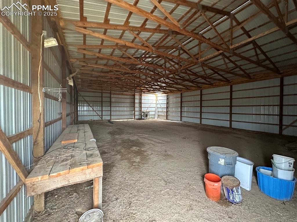 Image 9 of 36: Garage featuring metal wall