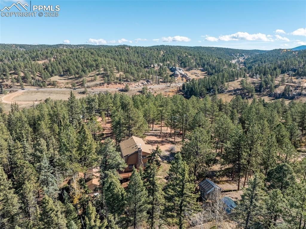 Image 17 of 50: Aerial view of house and greenhouses