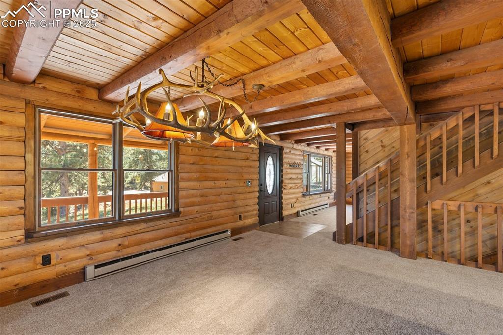 Image 24 of 50: View from dining room to entry.