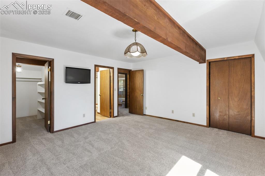 Image 31 of 50: Master bedroom has two walk-in closets and attached bath. 