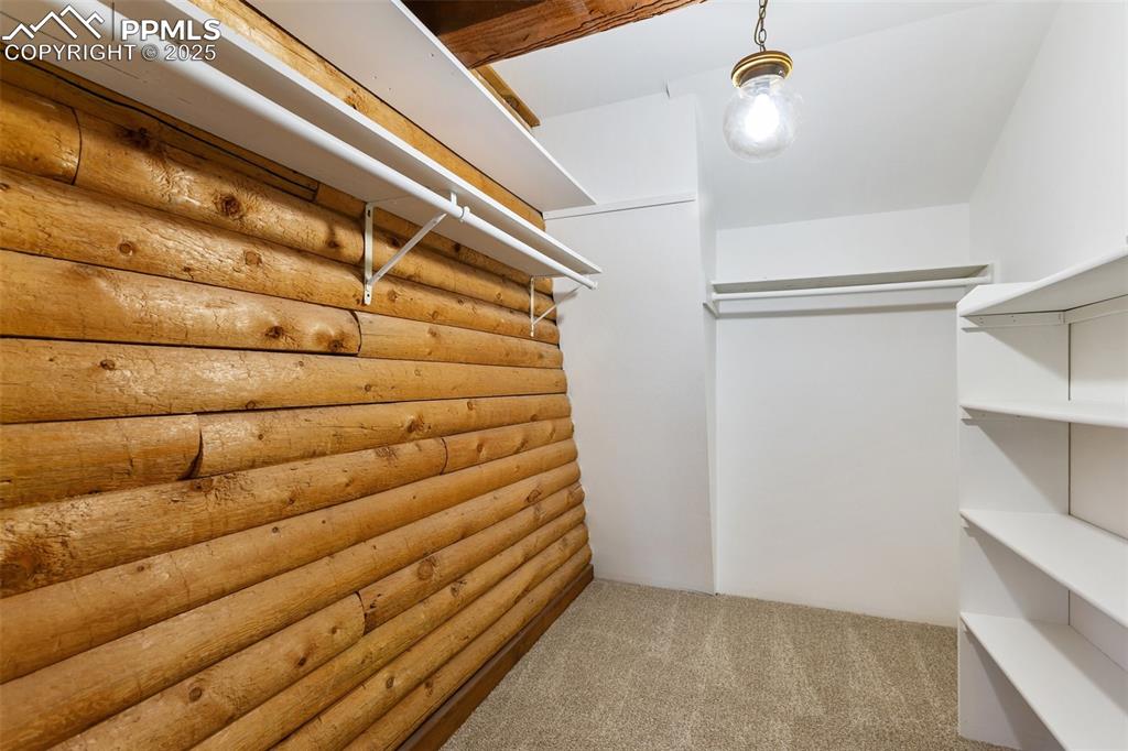 Image 32 of 50: One of two master bedroom closets.