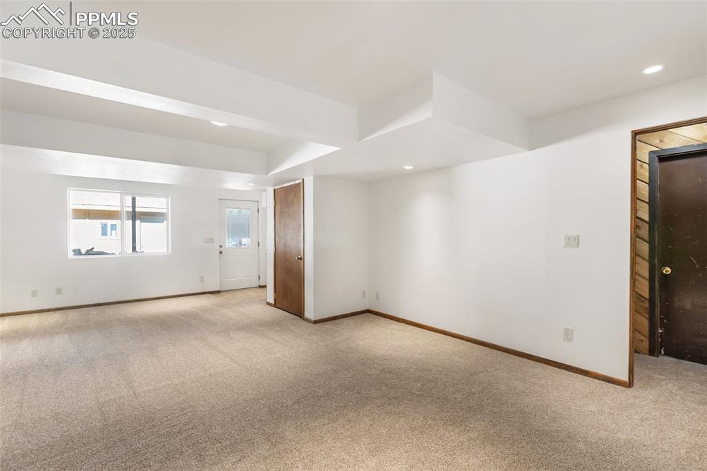 Image 45 of 50: Walk-out family room on lower level