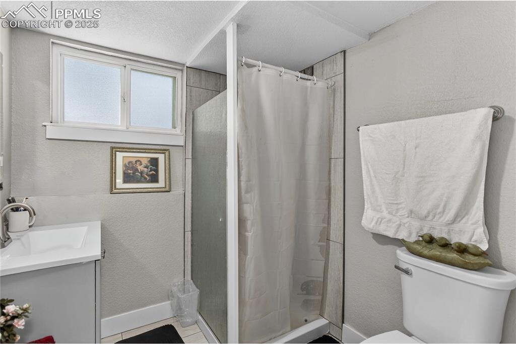 Image 13 of 21: Guest bath - lower level