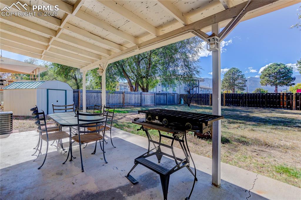 Image 15 of 21: Covered back patio