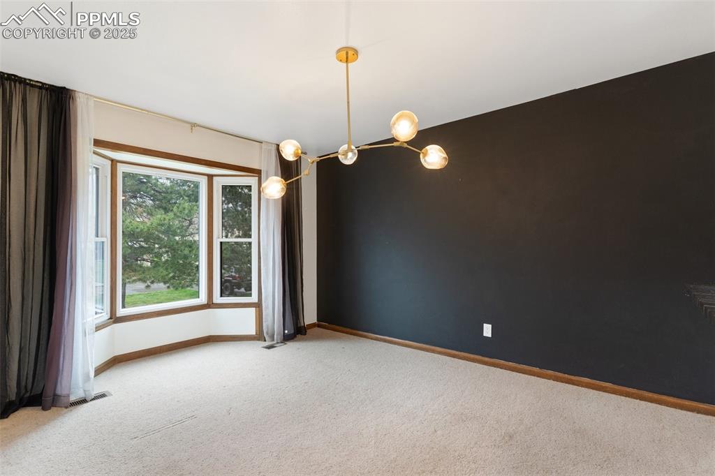 Image 12 of 23: Dining room with bay window