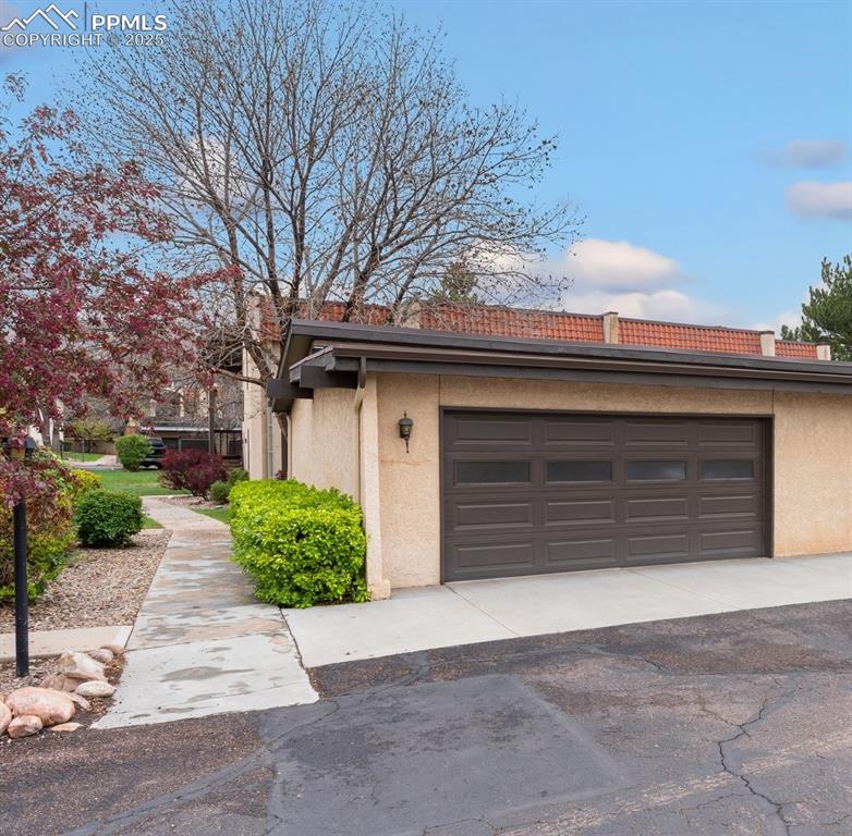 Image 2 of 23: Oversized 2 car garage; room for 2 sedans & storage or toys