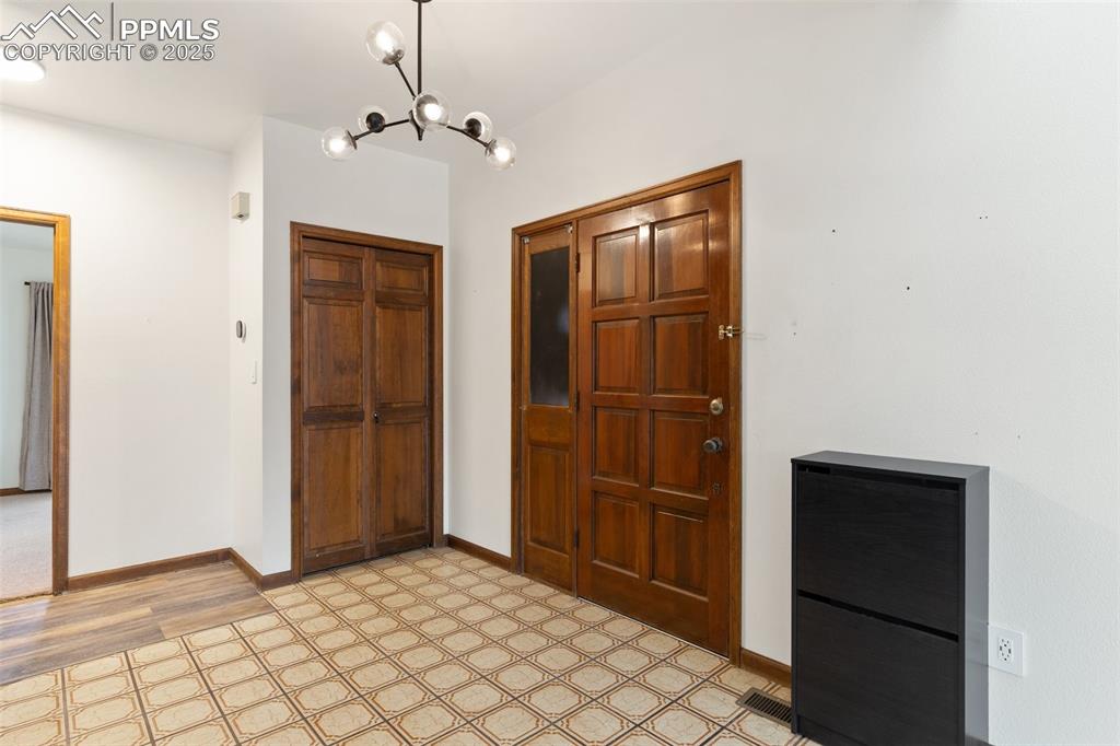 Image 6 of 23: Inviting foyer and coat closet