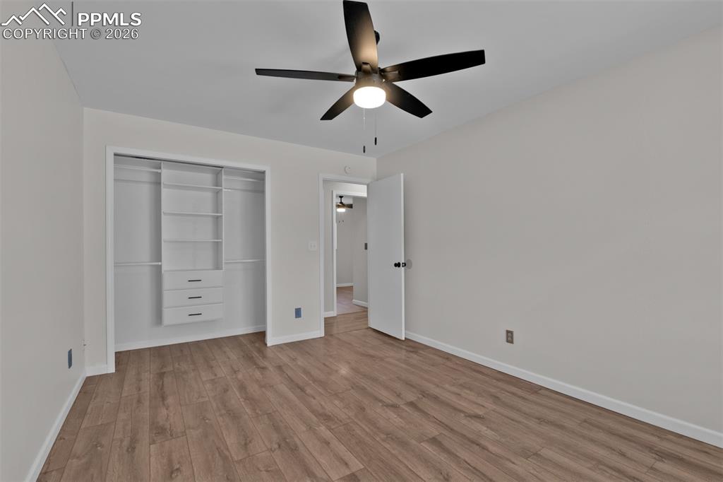 Image 18 of 42: Closet with built-ins (Closet doors are available and left with the home.)