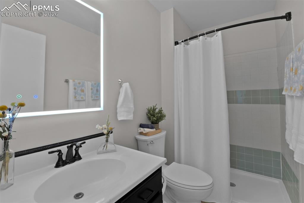 Image 22 of 42: Fresh paint, new flooring and lighted vanity mirror bring modern touches. 