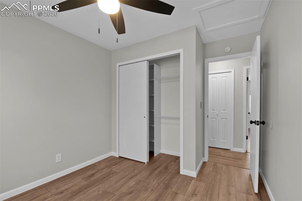 Image 26 of 42: Secondary Bedroom #2 with fresh paint and updated LVP flooring. 