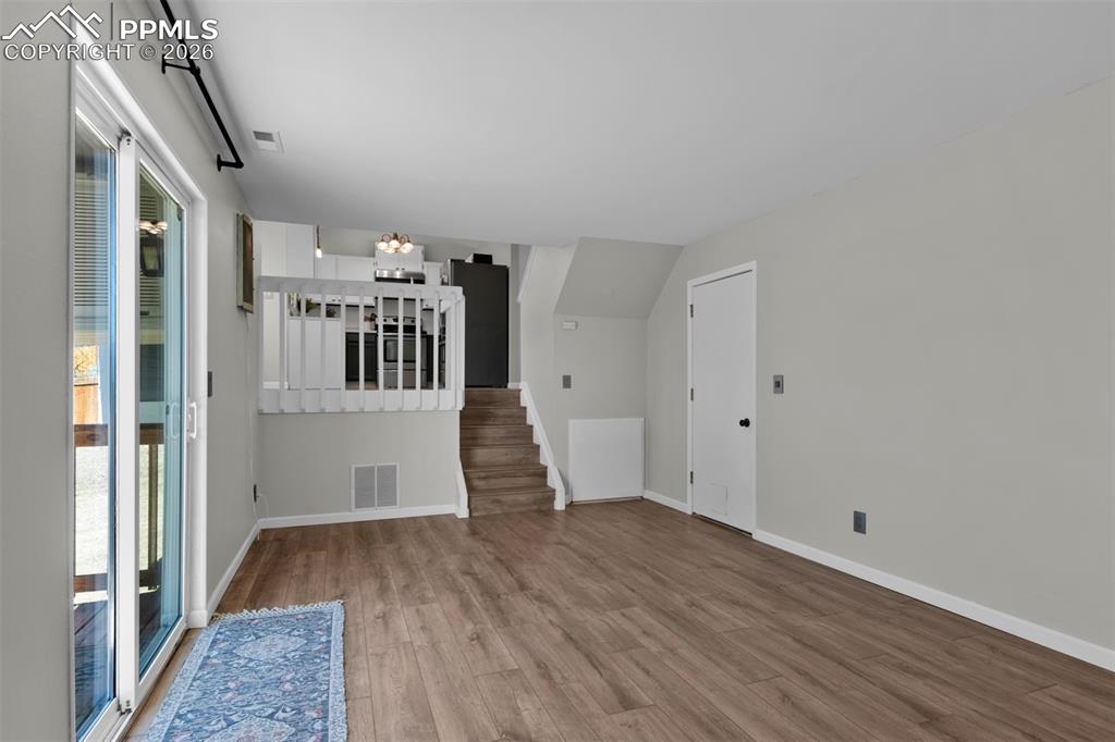 Image 32 of 42: Opposite view of the Family Room open to the dining and kitchen. Access to 