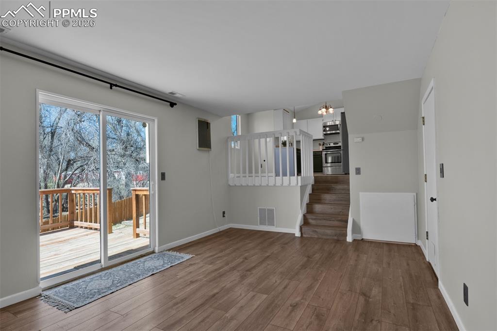 Image 33 of 42: Opposite view of the Family Room open to the dining and kitchen. Access to 