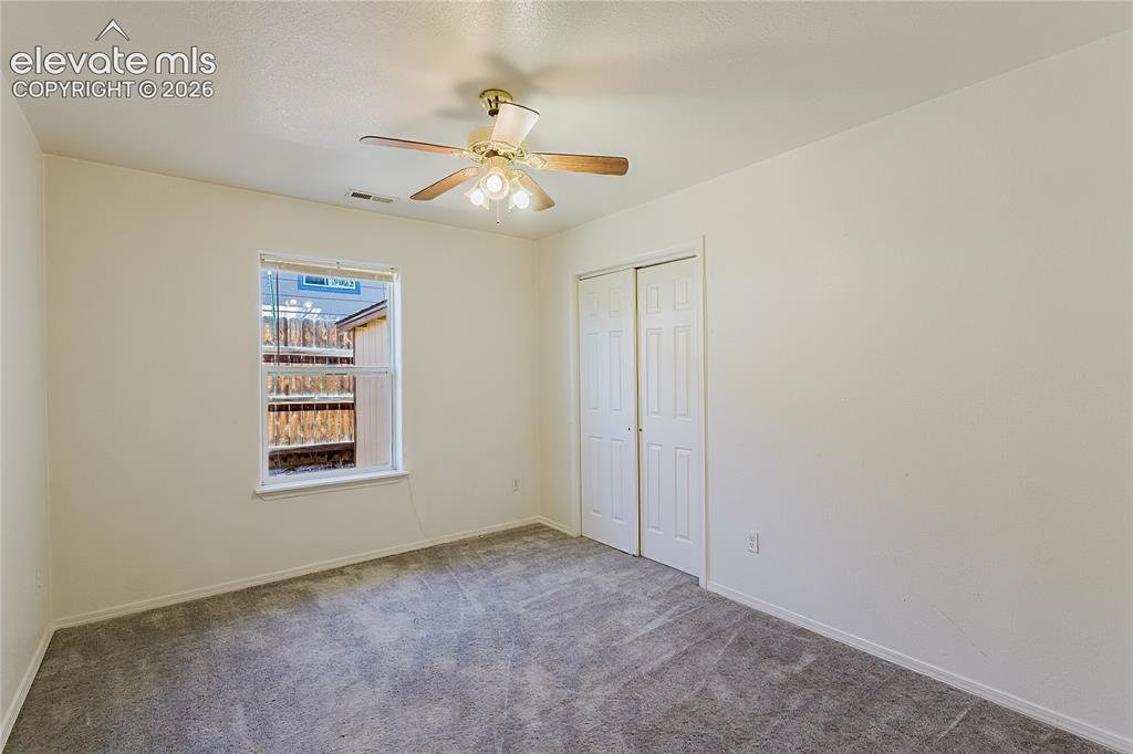 Image 19 of 27:
1st bedroom on right, window to side yard and closet