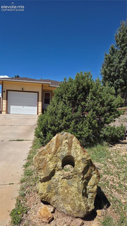 Image 2 of 27: Historic mining relic from the Cripple Creek/Victor district adds character