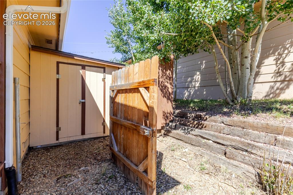 Image 26 of 27: Large storage shed easily accessible from the front gate; has power running