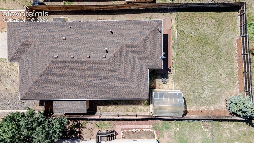 Image 5 of 27: Aerial of home, 1 year old roof, privacy fencing enclosed backyard