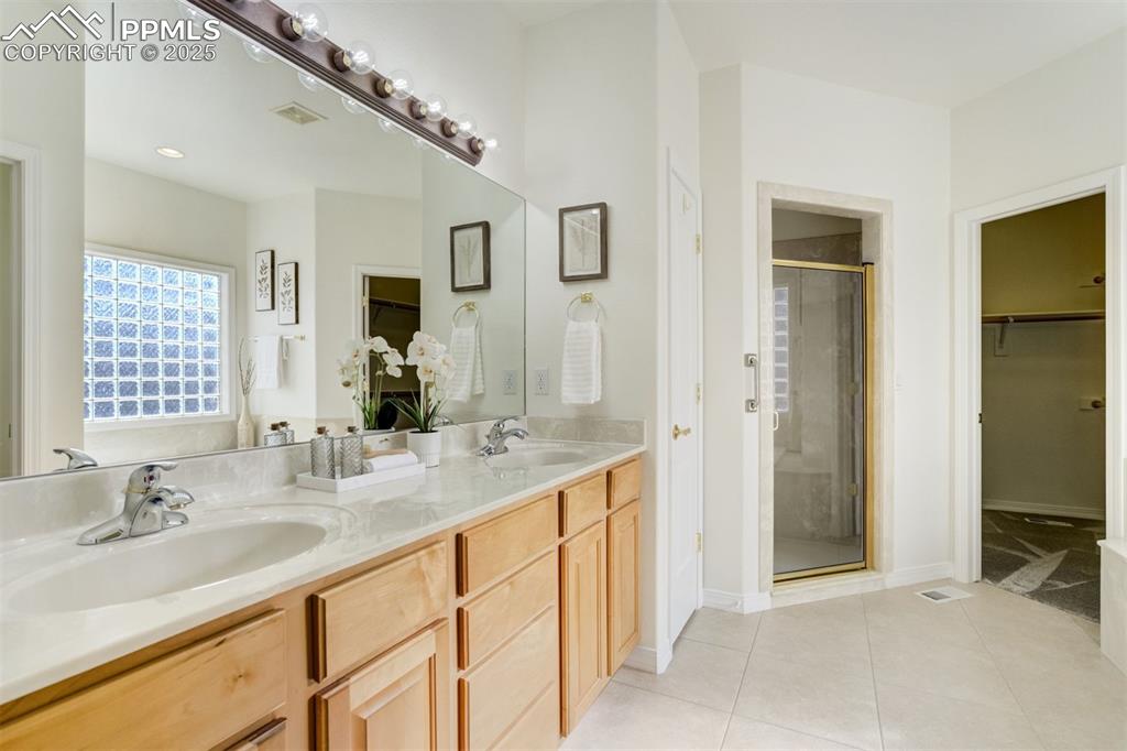 Image 10 of 50: The primary bathroom features a 5-piece bath.