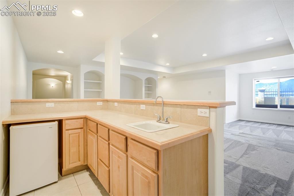 Image 36 of 50: Wet Bar in the basement