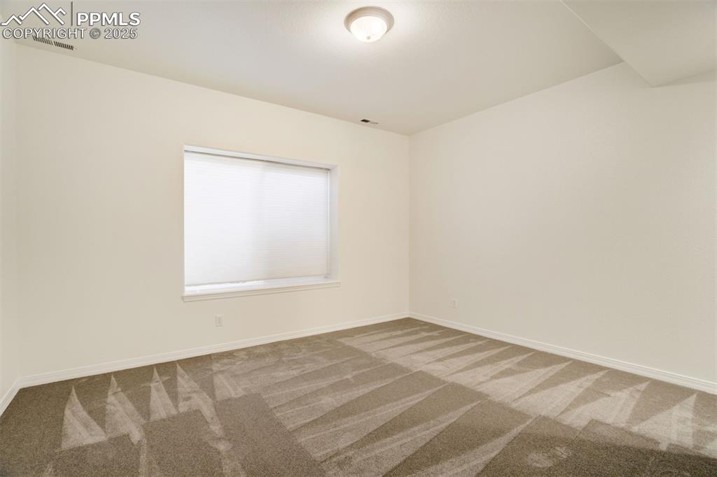 Image 40 of 50: Basement Bedroom