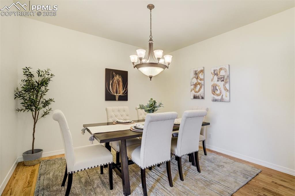 Image 8 of 50: The formal dining area resides just off of the kitchen and is complete with