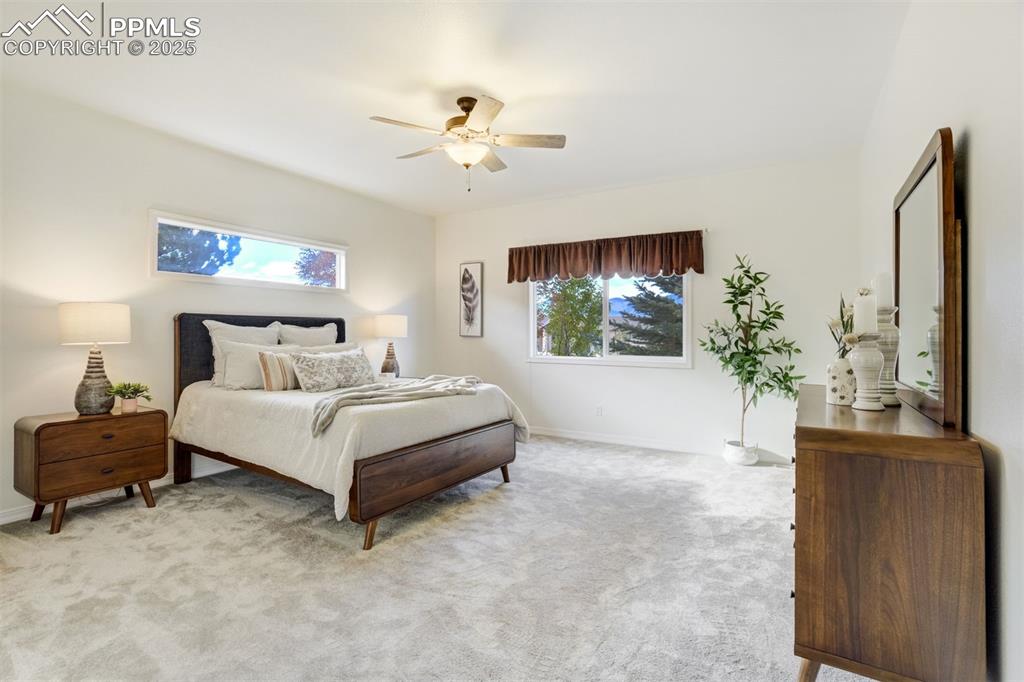 Image 9 of 50: The primary suite has a beautiful transom window that amplifies the light i